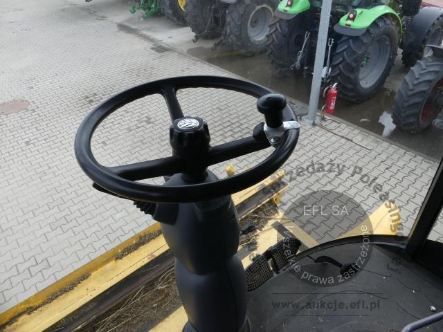 17 - EFL Finance Kombajn zbożowy New Holland CSX 7070 2009r. z hederem i wózkiem
