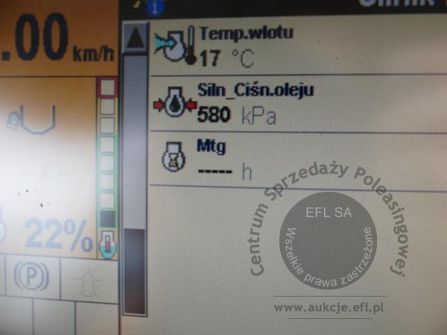22 - EFL Finance Kombajn zbożowy New Holland CSX 7070 2009r. z hederem i wózkiem