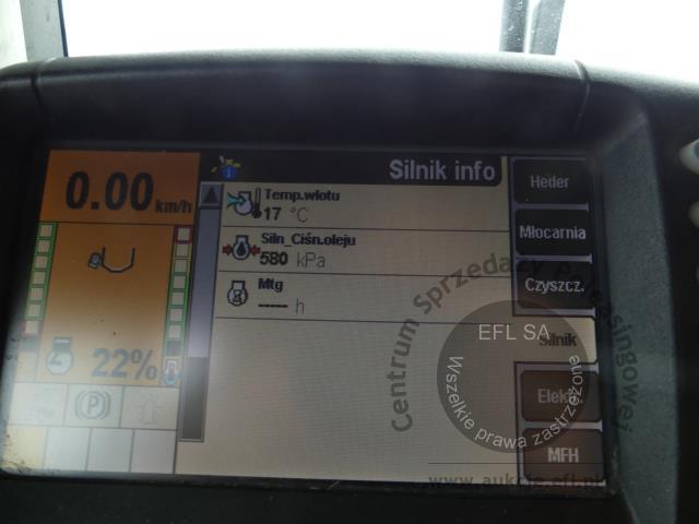 23 - EFL Finance Kombajn zbożowy New Holland CSX 7070 2009r. z hederem i wózkiem
