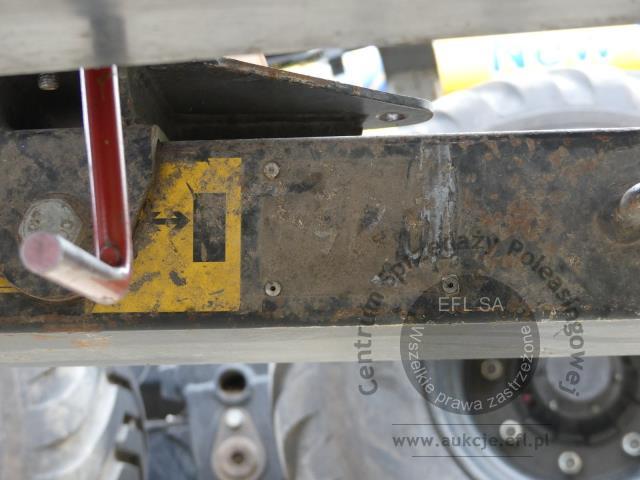 26 - EFL Finance Kombajn zbożowy New Holland CSX 7070 2009r. z hederem i wózkiem