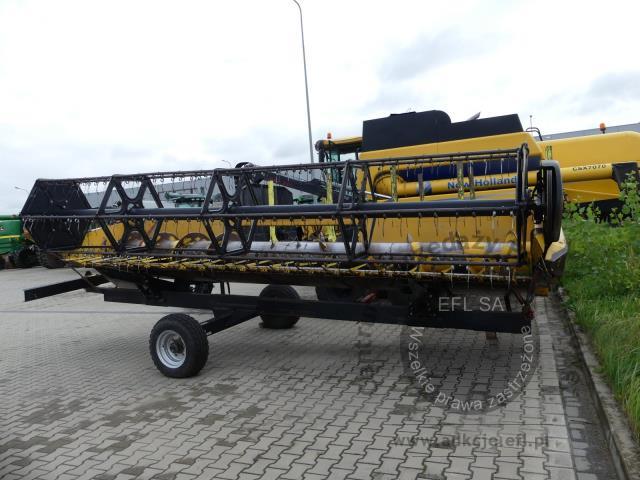 29 - EFL Finance Kombajn zbożowy New Holland CSX 7070 2009r. z hederem i wózkiem