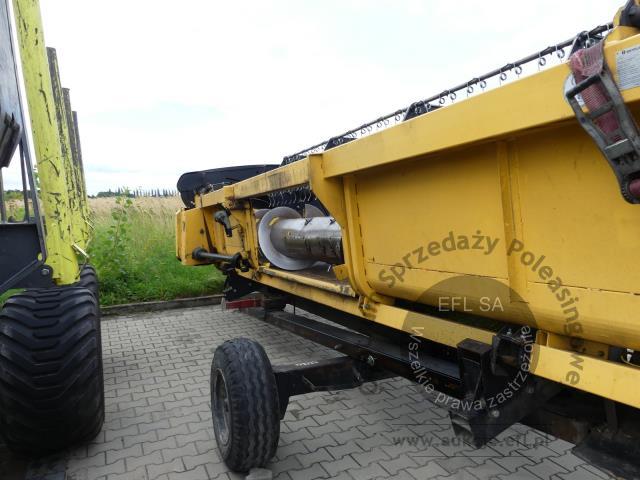 31 - EFL Finance Kombajn zbożowy New Holland CSX 7070 2009r. z hederem i wózkiem