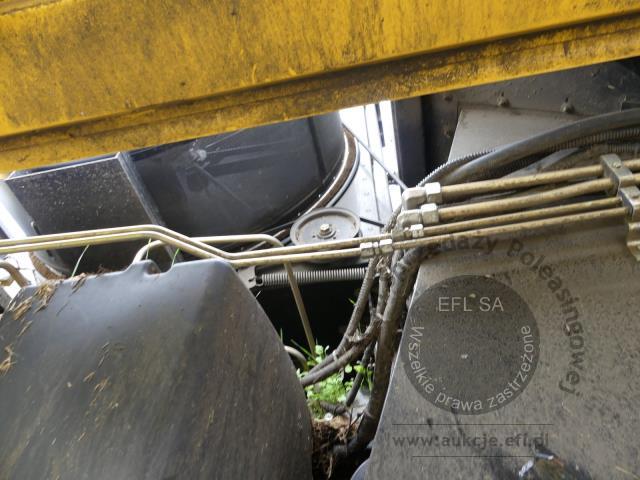 9 - EFL Finance Kombajn zbożowy New Holland CSX 7070 2009r. z hederem i wózkiem